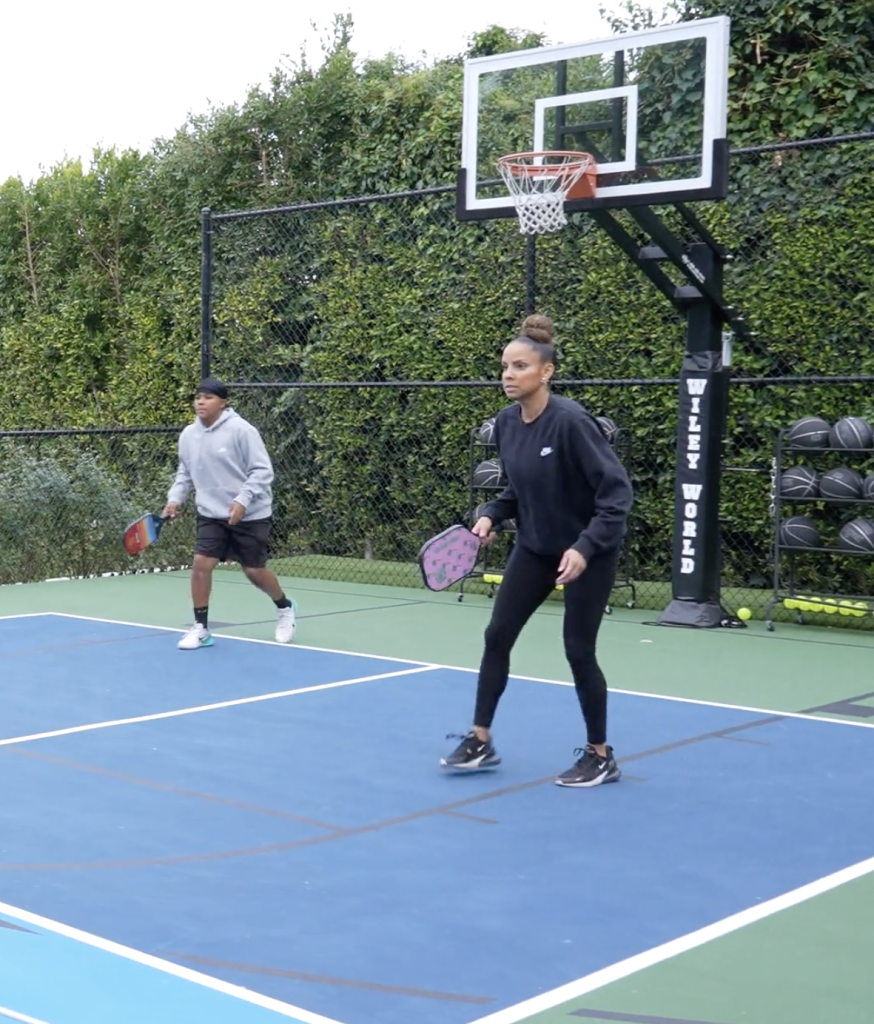 Two people playing paddle tennis